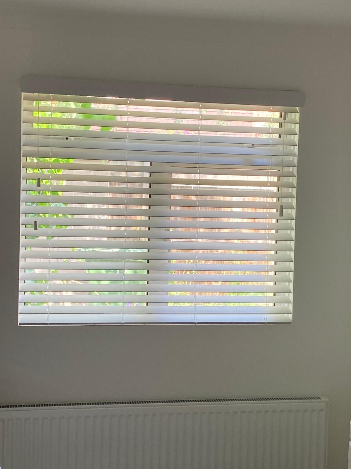 White Venetian blind on a window — Sustainable Shutters & Blinds