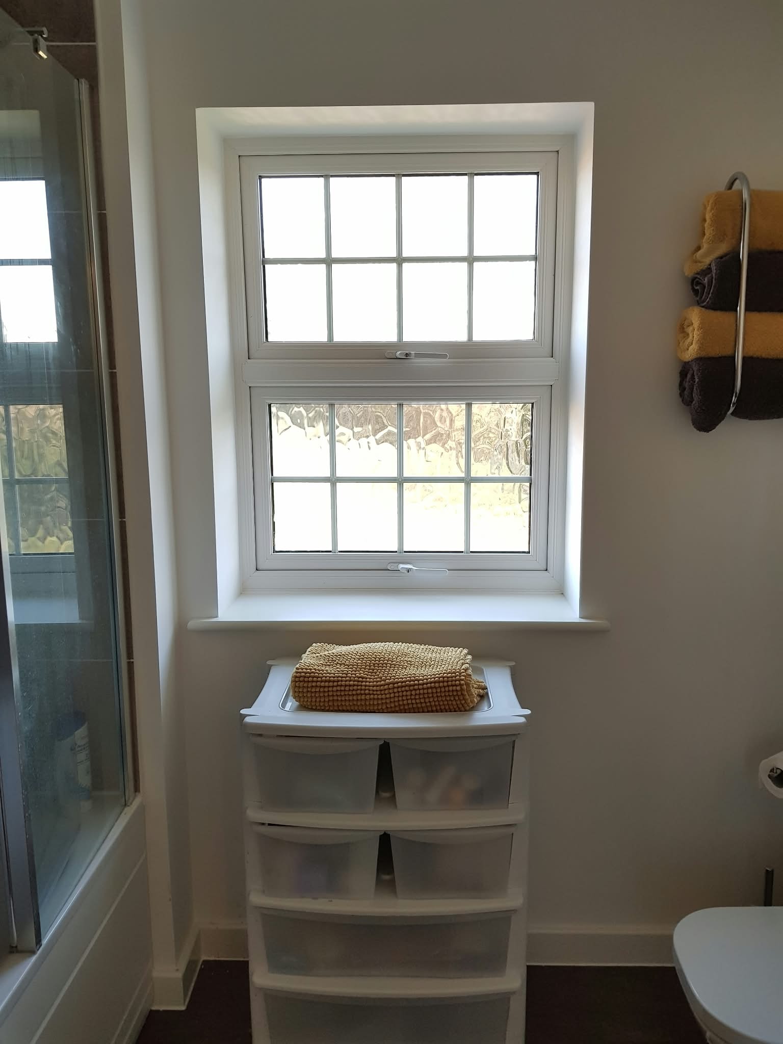 Bathroom window with storage drawers — Sustainable Shutters & Blinds